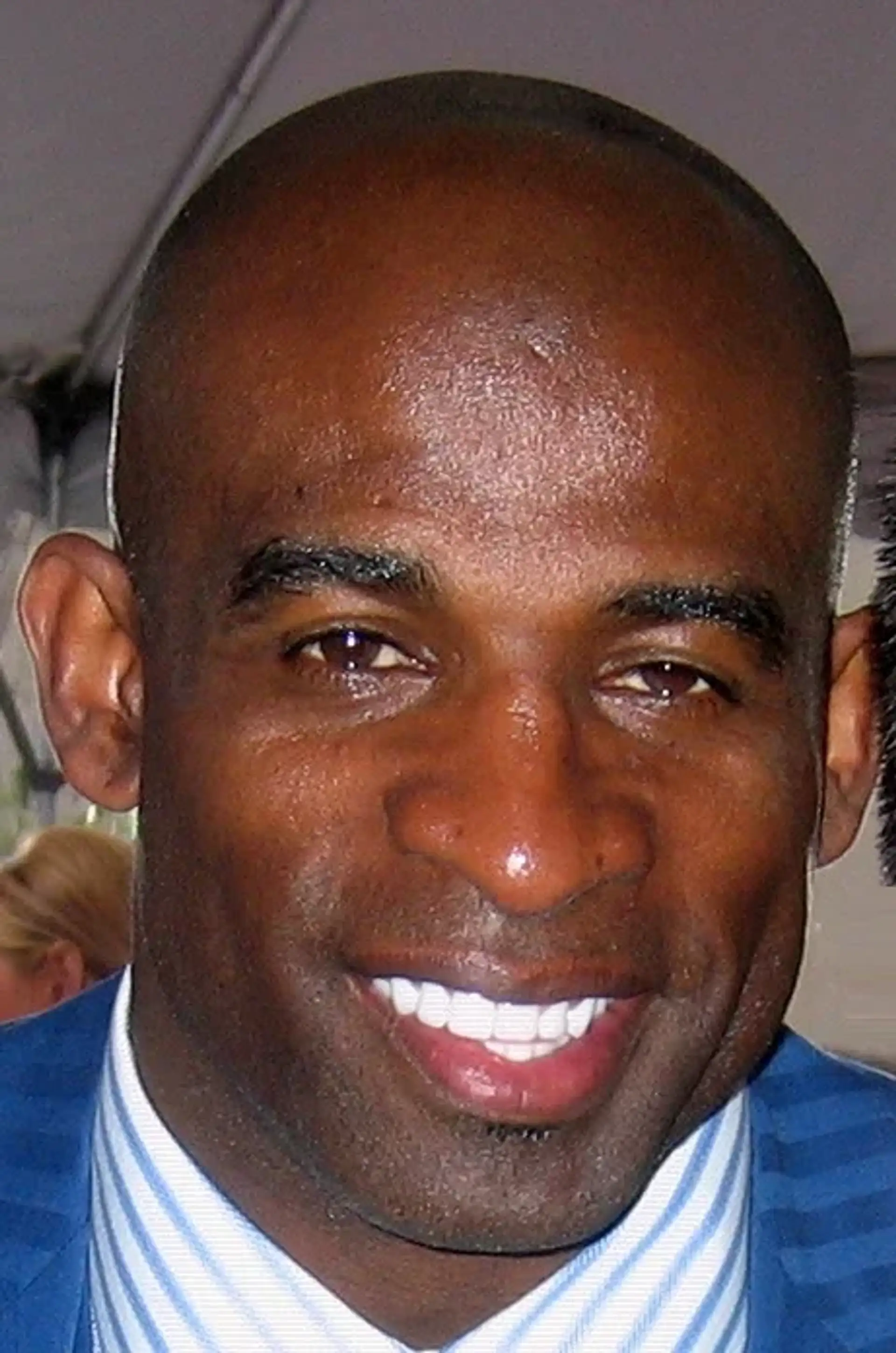 Deion Sanders, photographed in public. Licensed image; not evidence of any procedure.