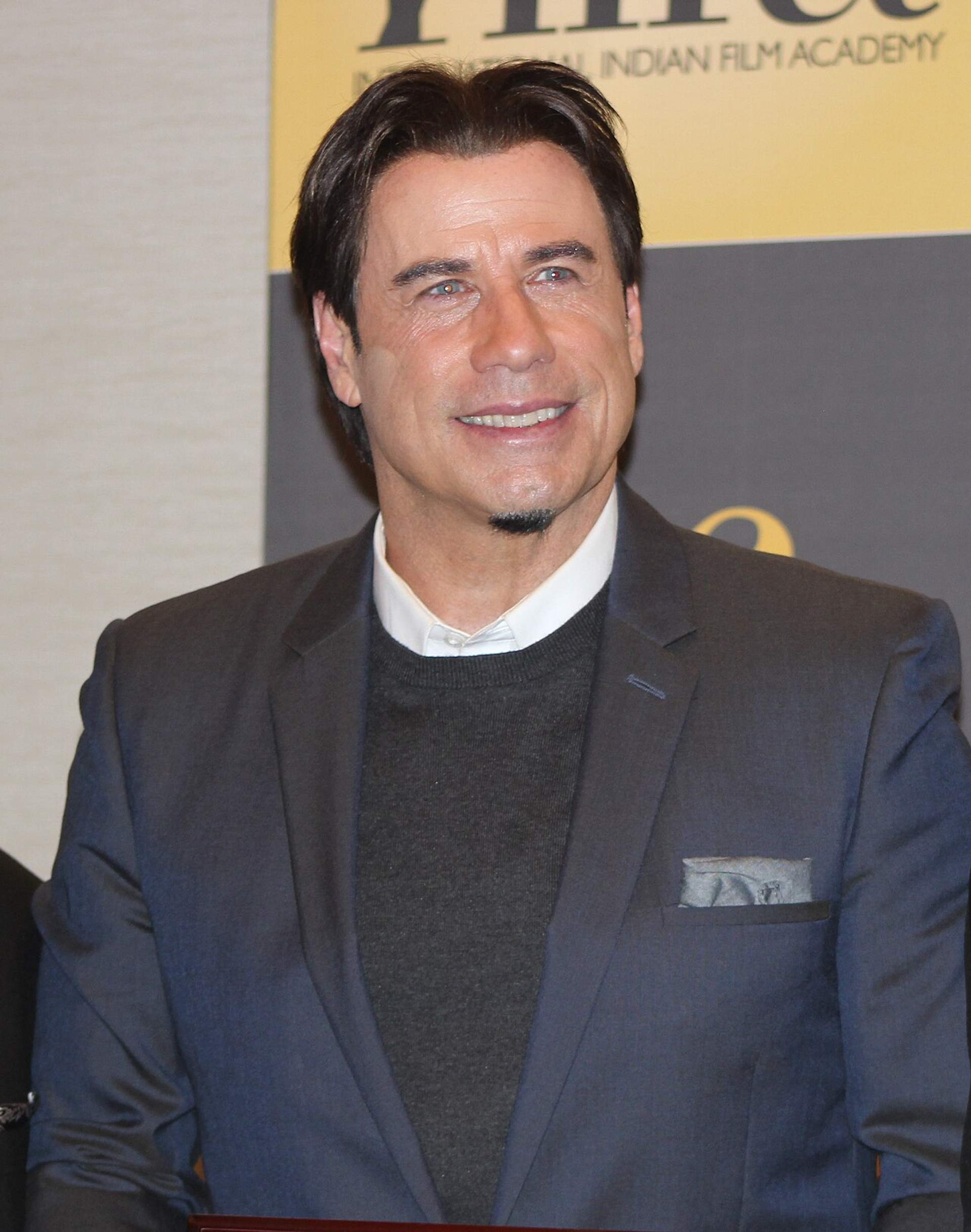 John Travolta, photographed in public. Licensed image; not evidence of any procedure.