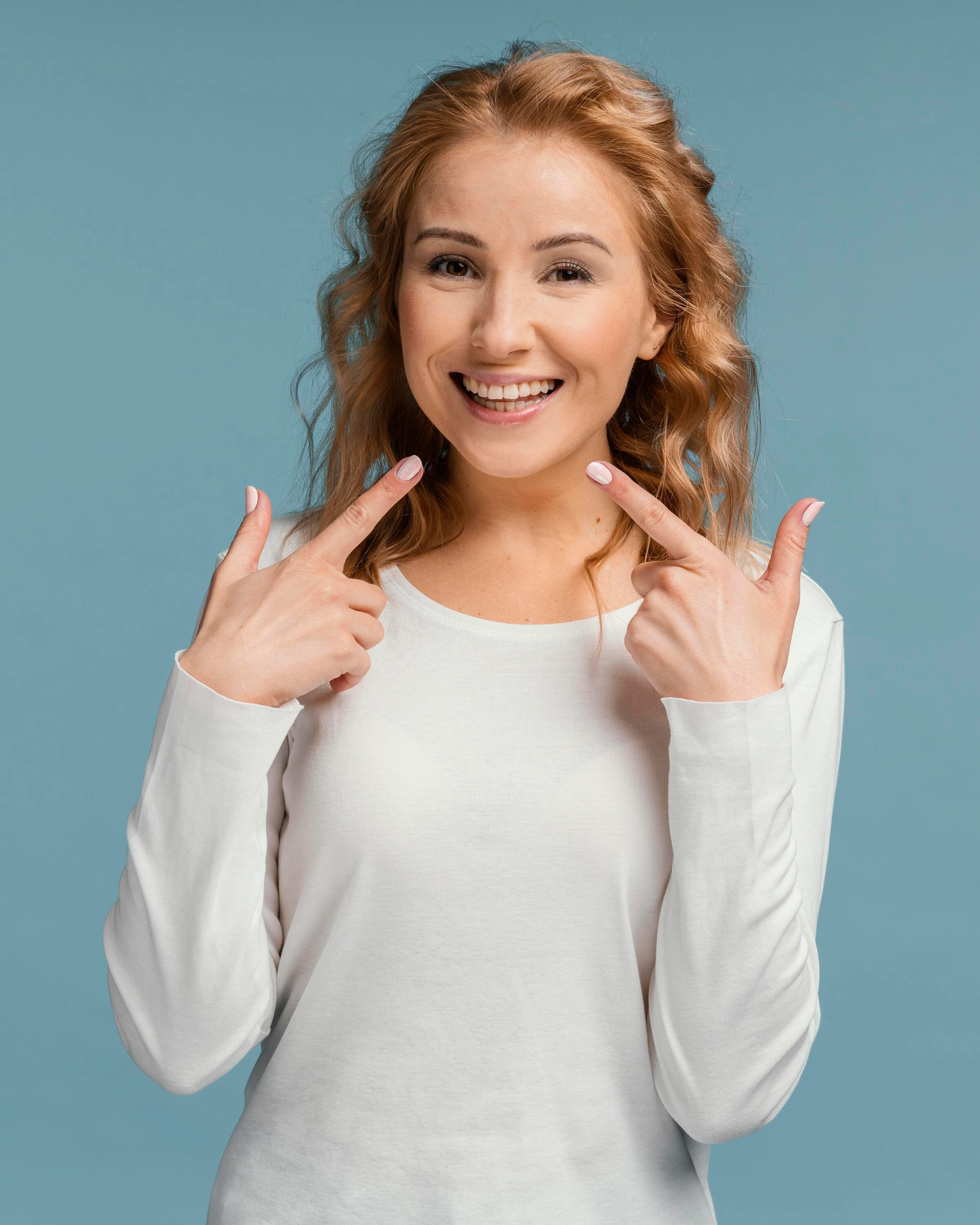laughing-woman-pointing-her-mouth